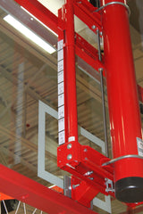 Red basketball backboard height adjuster with metric and imperial measurements on a clear backboard.