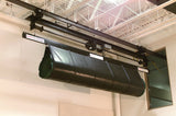Overhead mat carrier system with a rolled-up dark green mat, mounted on ceiling rails.