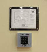 Keypad group controller with a schematic of two basketball courts and a red indicator light.