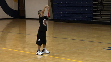 Coach Chris uses the Perfect Jump Shot Shooting Strap in the video.