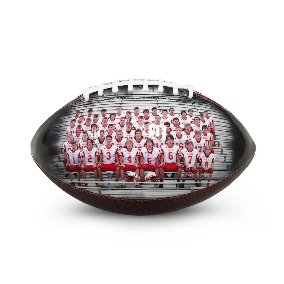 Youth football team on the field with custom footballs