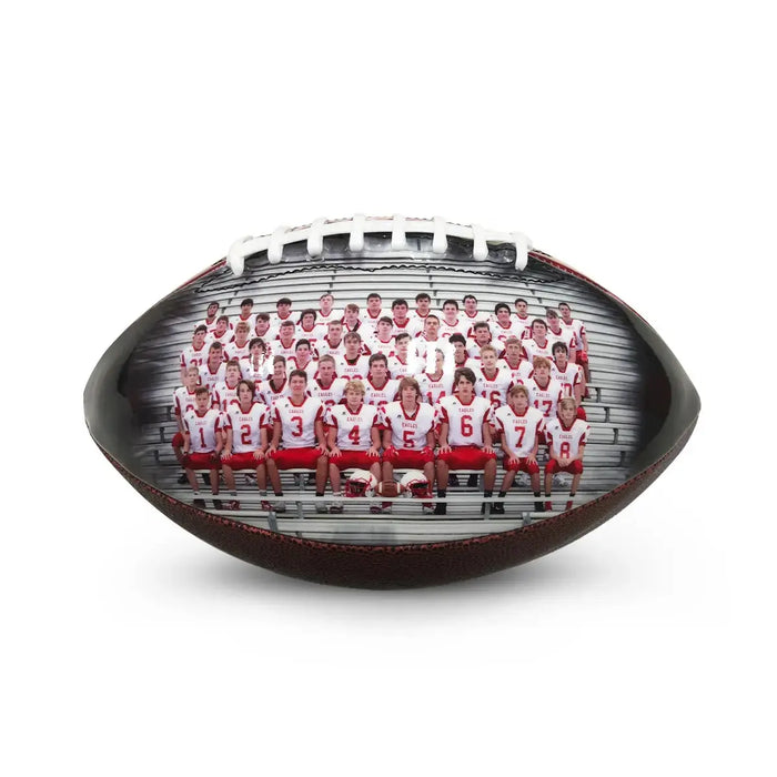 Youth football team on the field with custom footballs