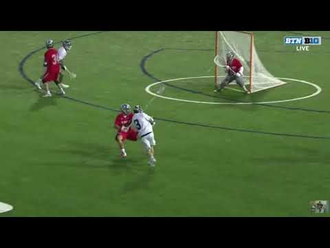 Lacrosse player winding up to shoot a fast shot on goal