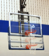 Basketball backboard and hoop with motion blur showing height adjustment.