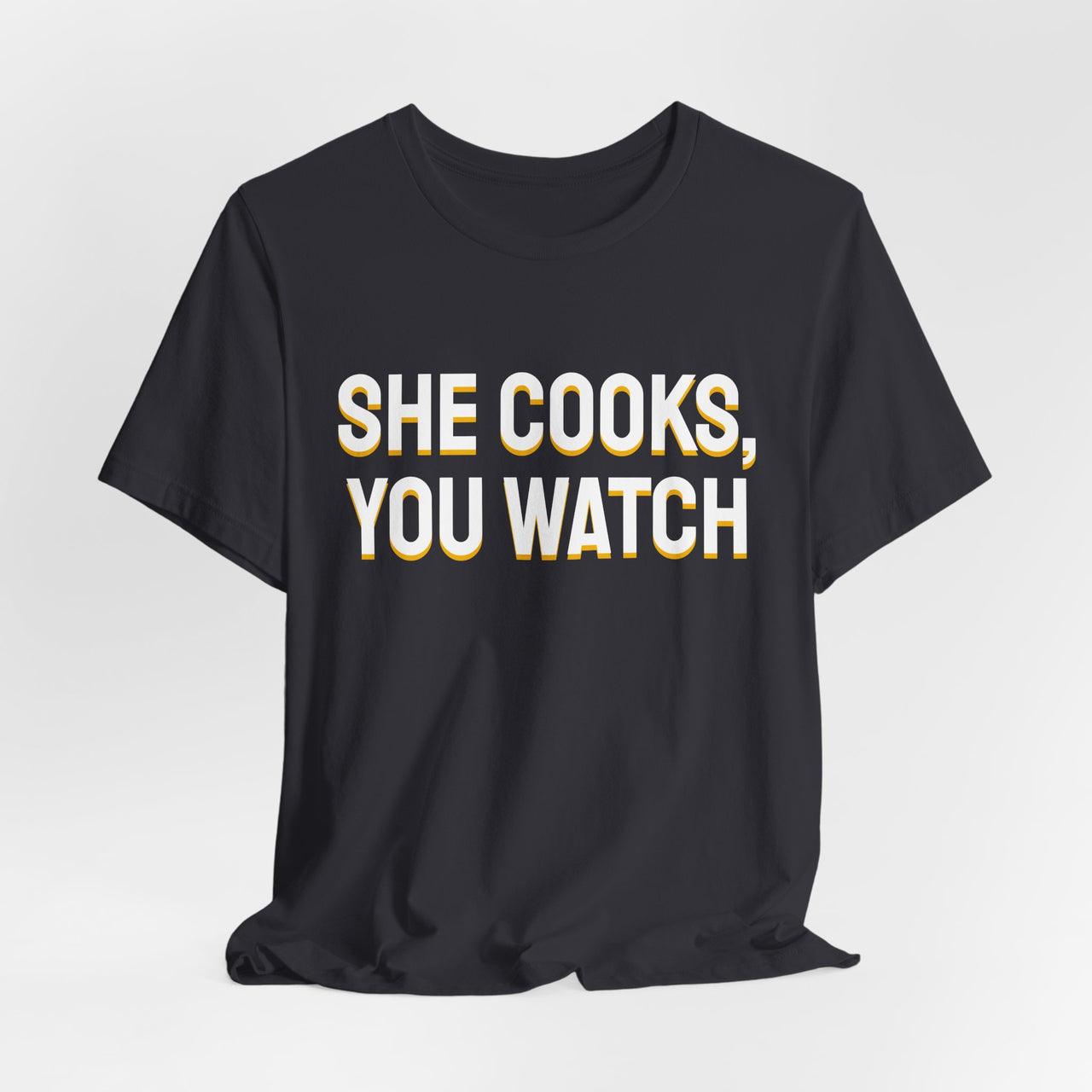 She Cooks, You Watch — Basketball T-Shirt
