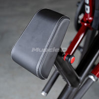 Thumbnail for Black padded armrest with white stitching on a red and black gym machine.