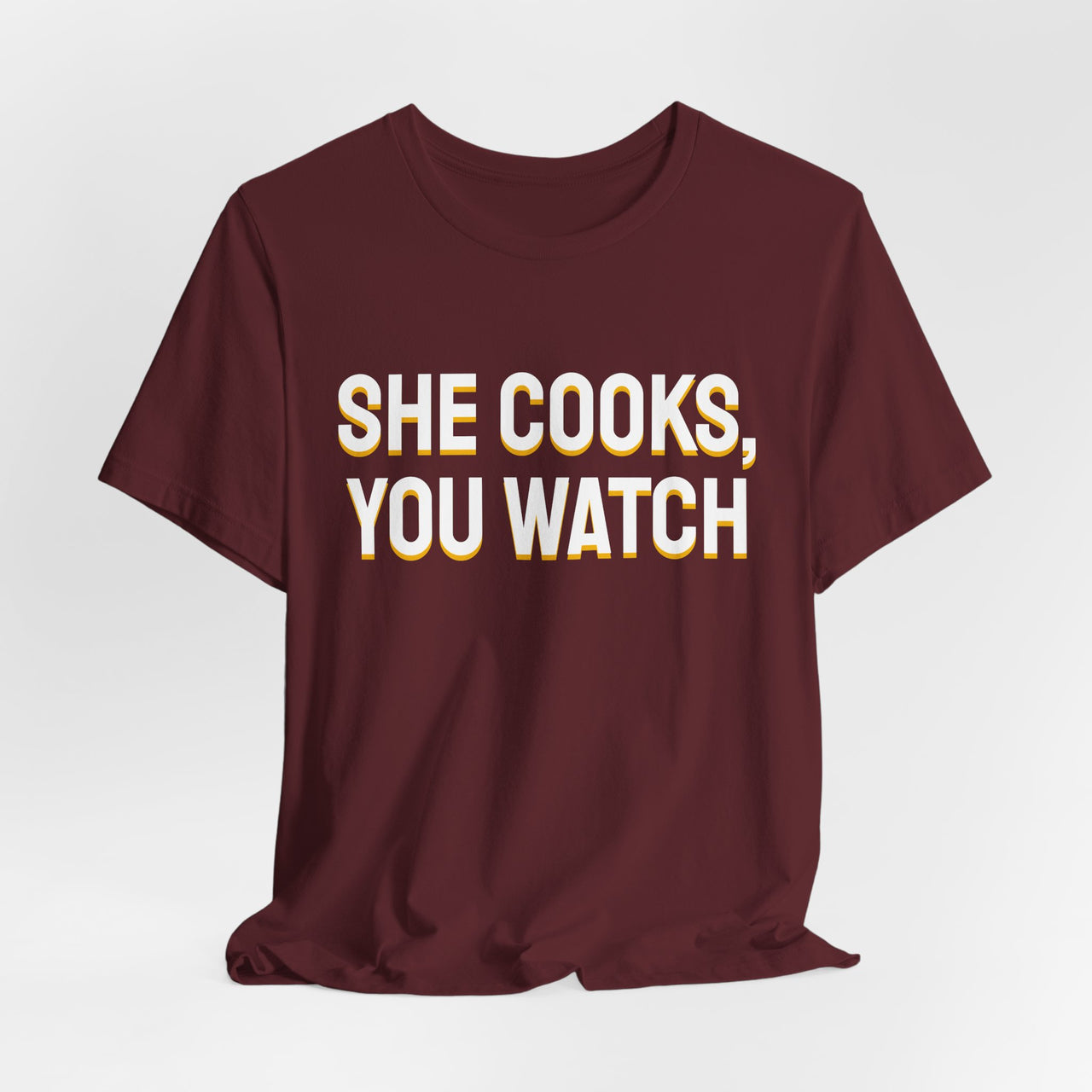 She Cooks, You Watch — Basketball T-Shirt