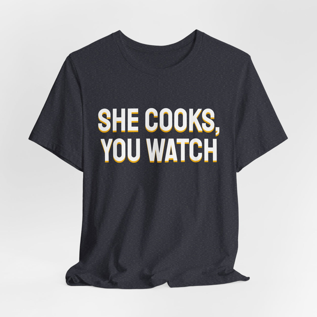 She Cooks, You Watch — Basketball T-Shirt