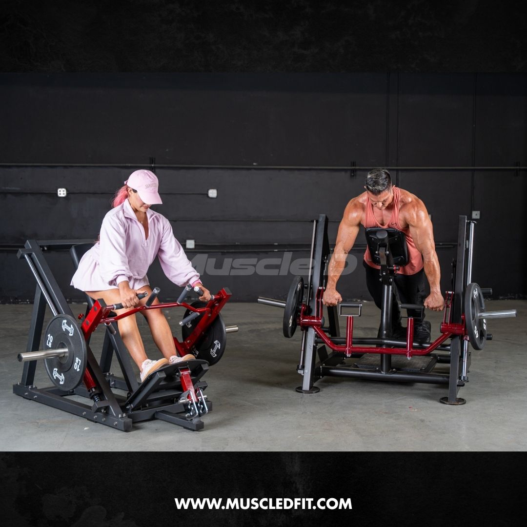Man using a chest-supported linear bearing row machine with a woman using a seated row machine in a gym.