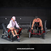 Thumbnail for Man using a chest-supported linear bearing row machine with a woman using a seated row machine in a gym.
