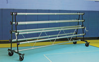 Thumbnail for A storage rack for 8 rolls of gym floor cover standing empty in a gym