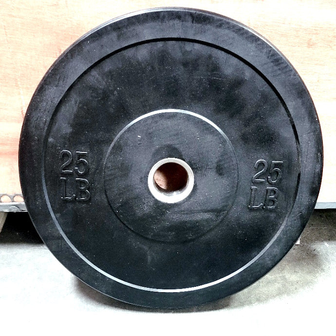 Black 25 LB bumper plate with steel center hub.