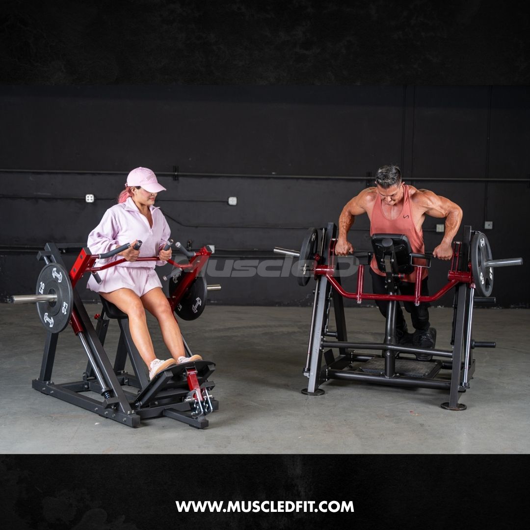Two people using black and red chest-supported linear bearing row machines in a gym.