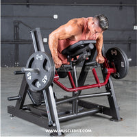 Thumbnail for Man using a chest-supported linear bearing row machine with weight plates.