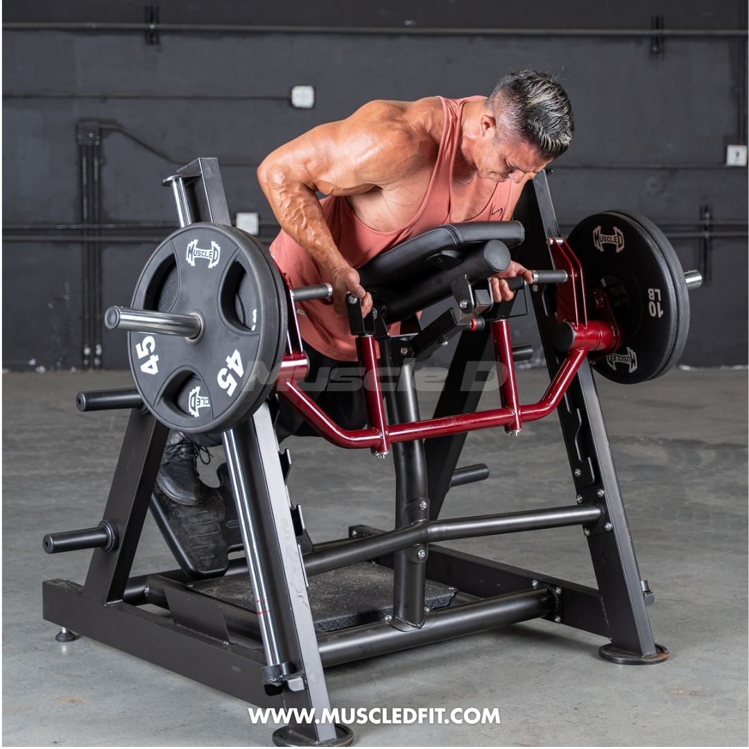 Man using a chest-supported linear bearing row machine with weight plates.