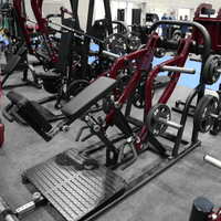 Thumbnail for Maroon plate-loaded chest-supported row machine with black padding and diamond plate foot platform.