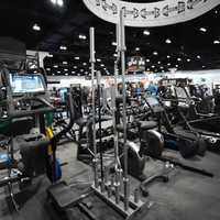 Thumbnail for Vertical Olympic bar rack with 5 bars in a gym setting.