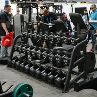 Thumbnail for Black 3-tier commercial dumbbell rack with various dumbbells in a gym setting.