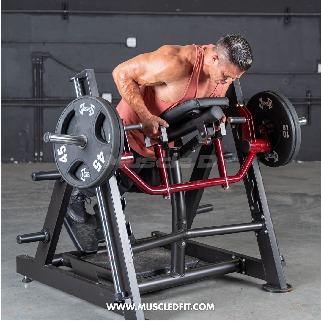 Man using a chest-supported linear bearing row machine with weight plates.