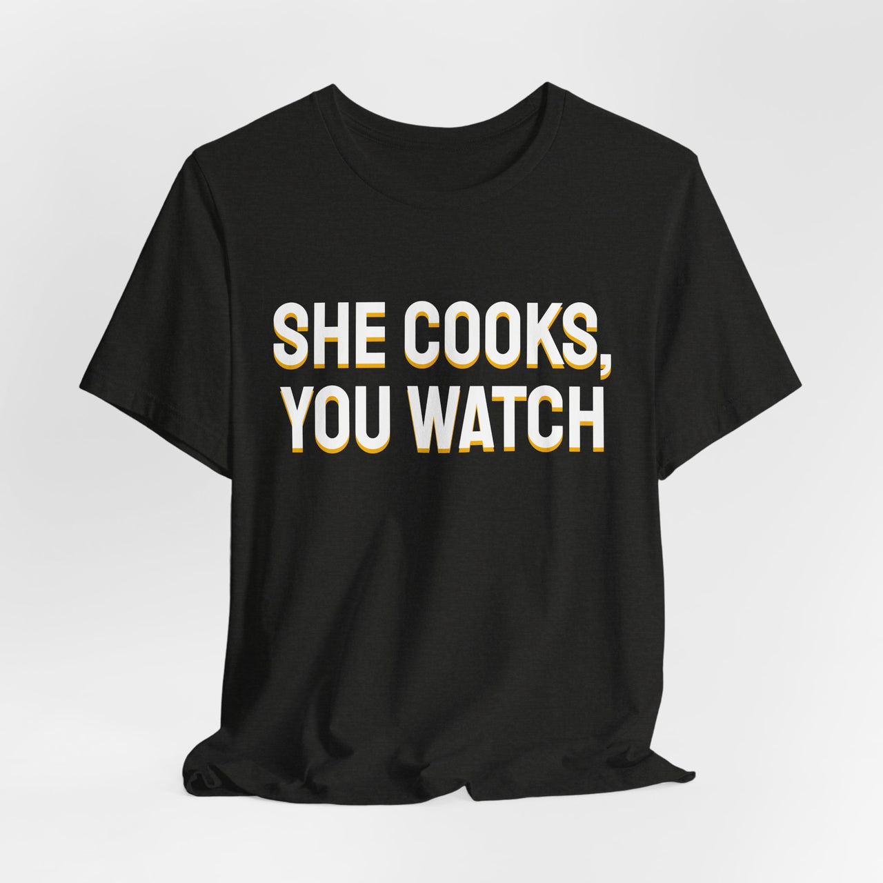 She Cooks, You Watch — Basketball T-Shirt