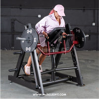 Thumbnail for Woman in pink hat and jacket using a chest-supported linear bearing row machine with 10lb plates.