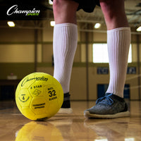 Thumbnail for Yellow Champion Sports 3-Star indoor soccer ball on a gym floor with a player's legs in the background.