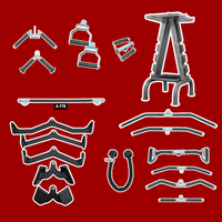 Thumbnail for A collection of black cable machine attachments and a gray storage rack on a red background.