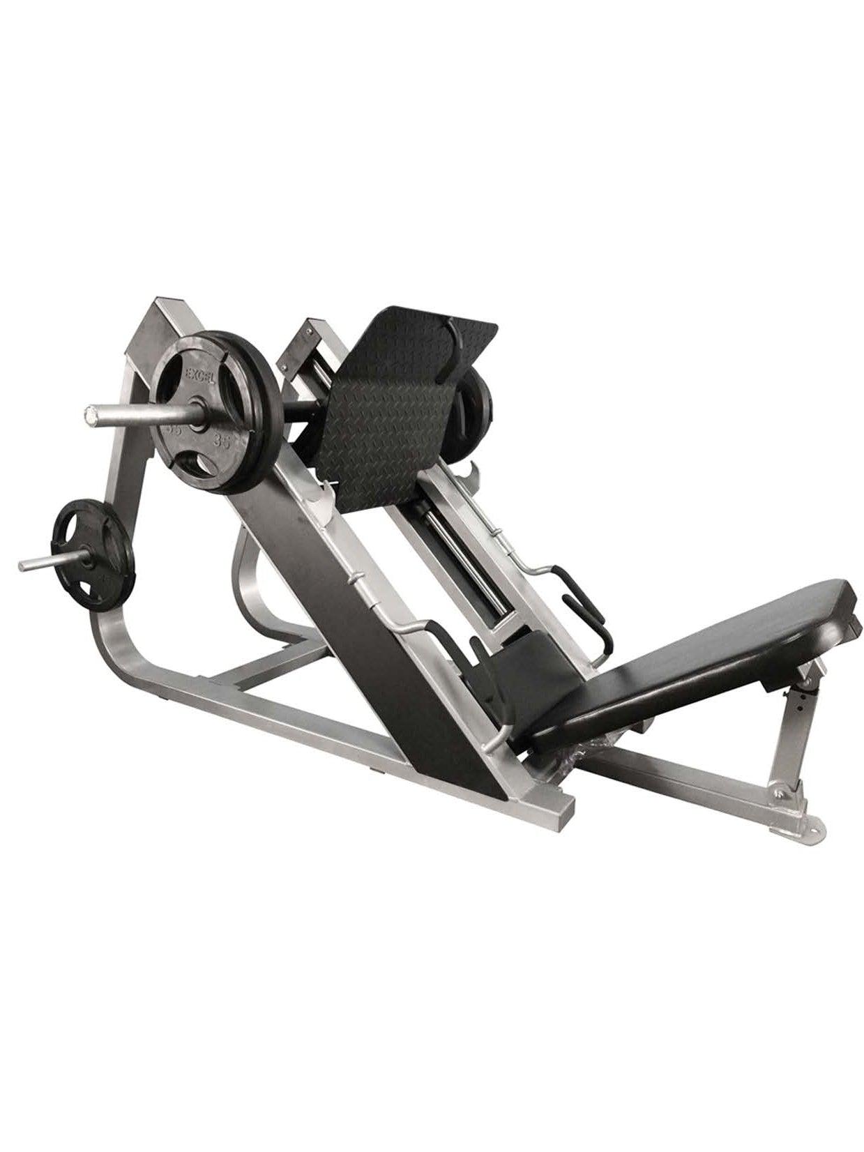 Gray and black 45-degree compact leg press machine with weight plates on a white background.