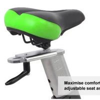 Thumbnail for Close-up of an exercise bike's black and green padded seat with an adjustable silver post.
