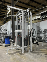Thumbnail for Silver 4-stack jungle gym with multiple pulleys and weight stacks in a gym setting.