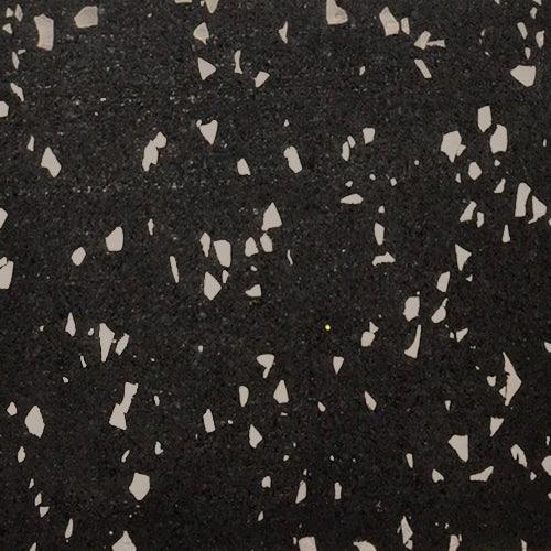 Close-up of black rubber gym flooring with scattered gray flecks.