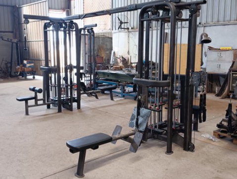 Black and silver 8-stack jungle gym with lat pulldown, pull-up, low row, and single/double pulleys.