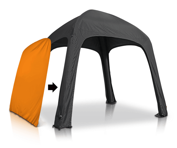 Black inflatable tent with an orange side panel being added, indicated by an arrow.