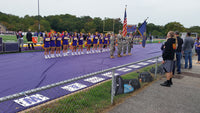 Thumbnail for Purple fabric track protector with cheerleaders and color guard standing on it