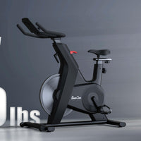 Thumbnail for Black upright exercise bike with adjustable seat and handlebars, red tension knob, and 