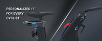 Thumbnail for Close-up of an exercise bike's adjustable seat and handlebars with blue arrows indicating movement.