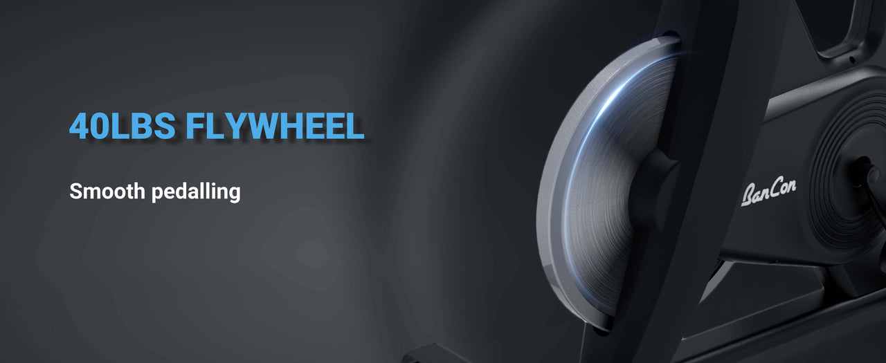 Close-up of an exercise bike's 40lb flywheel with "BanCon" logo and text "40LBS FLYWHEEL Smooth pedalling".