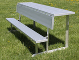 Silver portable bench with a shelf, set on green grass with small yellow flowers.