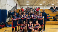 Thumbnail for Basketball team wearing blue jerseys and red arm sleeves, posing with coaches on a court.