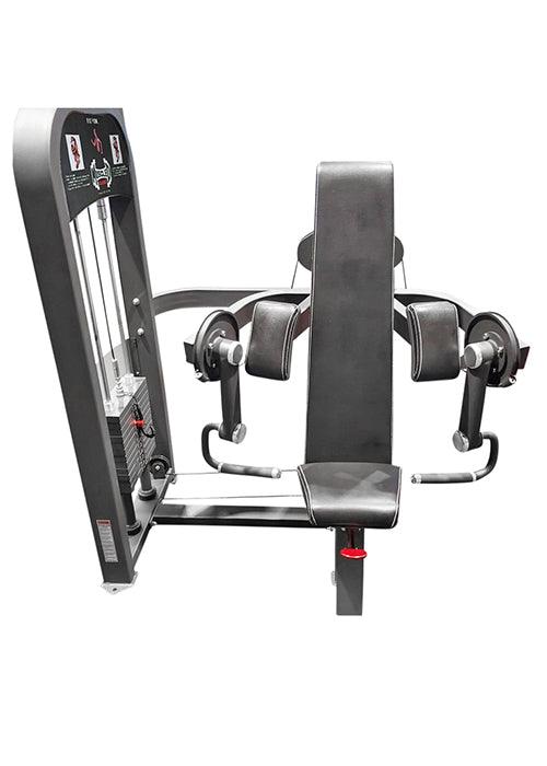 Gray biceps curl machine with black padded seat, backrest, and arm pads, and a weight stack.