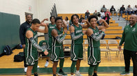 Thumbnail for Basketball players in green uniforms flexing, wearing black arm sleeves with 