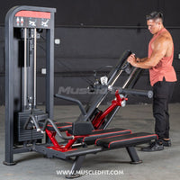 Thumbnail for Man adjusting a black and red selectorized glute kick machine in a gym.