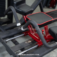 Thumbnail for Close-up of a glute kick machine with black padded seats, red frame, and black handles.