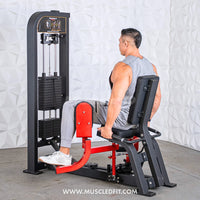 Thumbnail for Man using a black and red inner/outer thigh combo machine with weight stack.