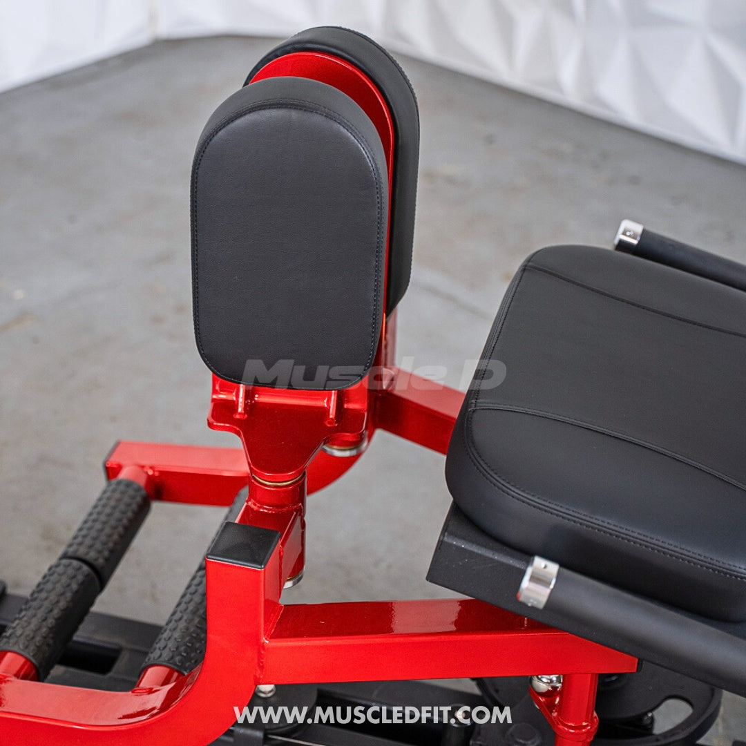 Close-up of the red frame and black pads of a selectorized inner/outer thigh combo machine.