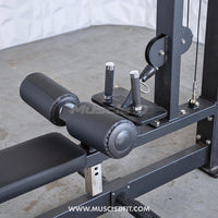 Thumbnail for Close-up of a black lat pulldown and low row combo machine with seat, leg pads, and footplate.