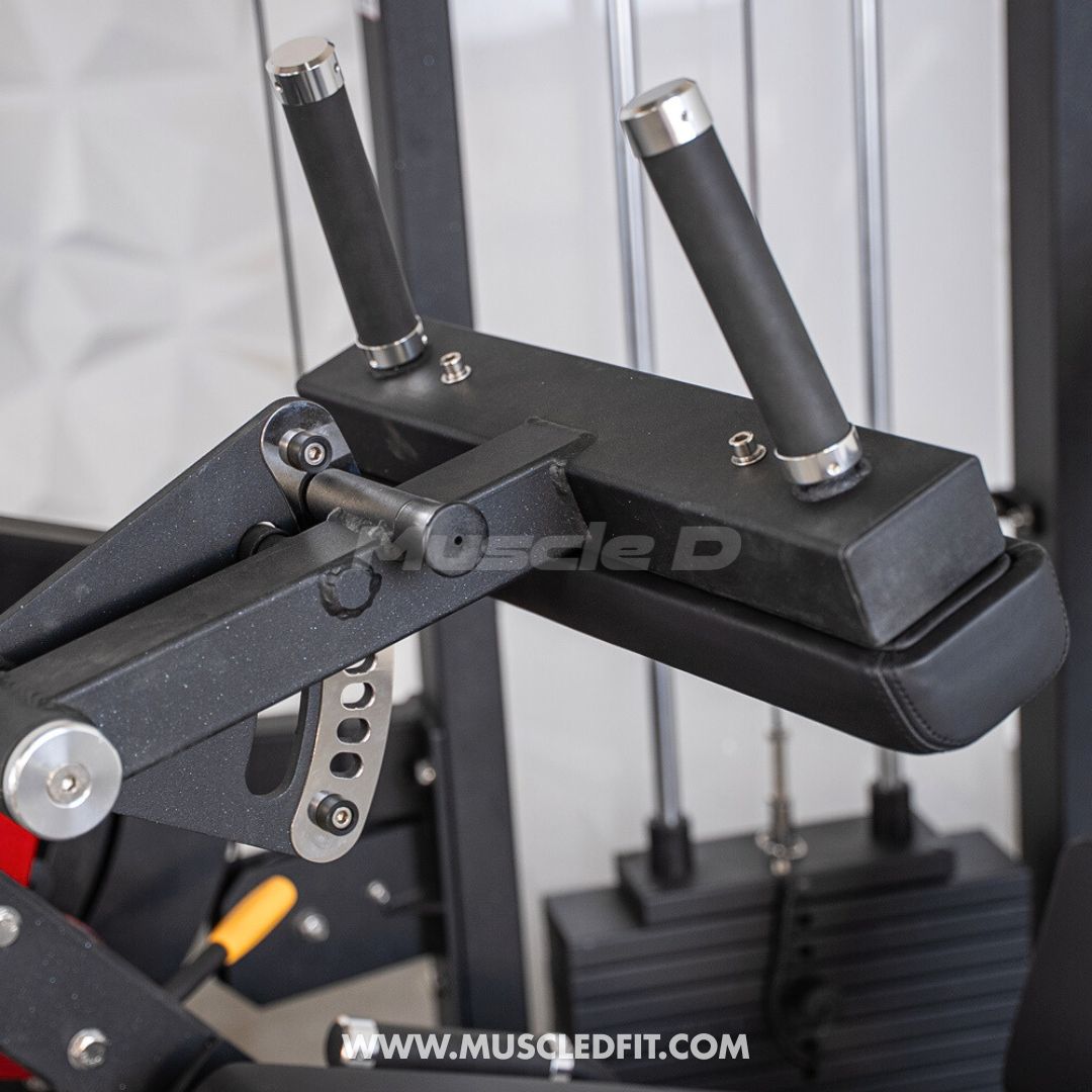 Close-up of the black padded leg roller and adjustment mechanism on a leg extension/curl machine.