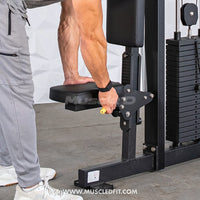 Thumbnail for Man adjusting the seat of a black selectorized pec/rear delt combo machine with a yellow knob.