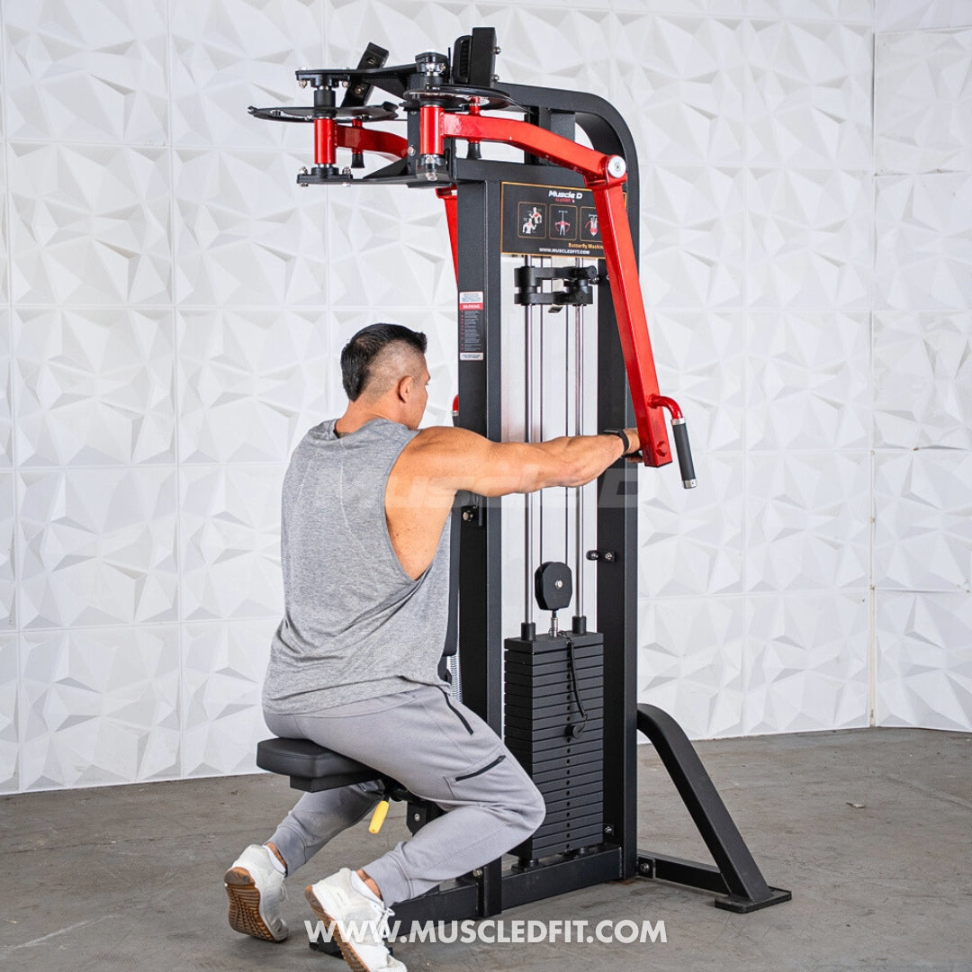 Man in gray tank top and sweatpants using a black and red pec/rear delt combo machine.