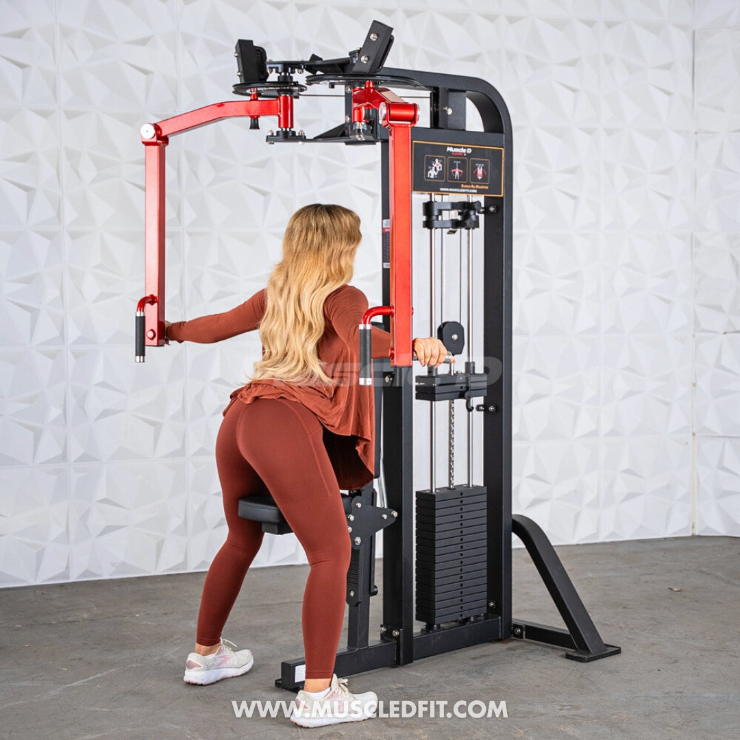 Woman with long blonde hair using a black and red pec/rear delt combo machine.